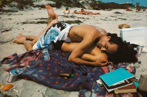 Nan Goldin Bruce on top of French Chris, Fire Island, N.Y. (1979) from The Ballad of Sexual Dependency, 1973–86. 126 archival pigment prints, in frames, each: 15 ¾ × 11 × 1 ⅛ inches (40 × 27.9 × 2.9 cm), overall dimensions variable, edition of 10 © Nan Goldin