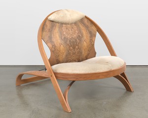 Richard Artschwager Chair/Chair, 1990. Red oak, Formica, cowhide, and painted steel, 39 × 40 × 52 inches (99.1 × 101.6 × 132.1 cm), edition of 100 © Estate of Richard Artschwager. Photo: Jackie Furtado