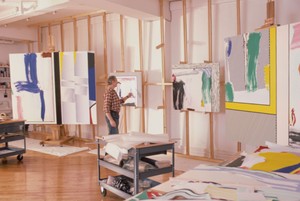 Roy Lichtenstein in his Washington Street studio, New York, 1985. Artwork © Estate of Roy Lichtenstein. Photo: © Hans Namuth