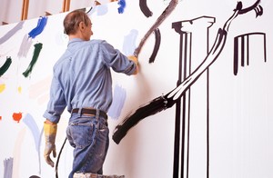 Roy Lichtenstein working on Forest Scene with Temple (1986) in his Southampton studio, New York, c. 1986. Artwork © Estate of Roy Lichtenstein. Photo: © Bob Adelman
