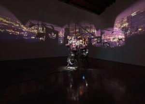 Sarah Sze Once in a Lifetime, 2026. Mixed media, wood, projectors, tripods, ladder, lights, aluminum, ceramic, paper, and paint, overall dimensions variable © Sarah Sze. Photo: Maris Hutchinson