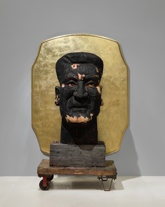 Titus Kaphar His Vision Is Grace (Sentinel 2), 2025. Charred wood, gold leaf, and found industrial object, 84 × 60 × 39 inches (213.4 × 152.4 × 99.1 cm) © Titus Kaphar. Photo: Thomas Lannes