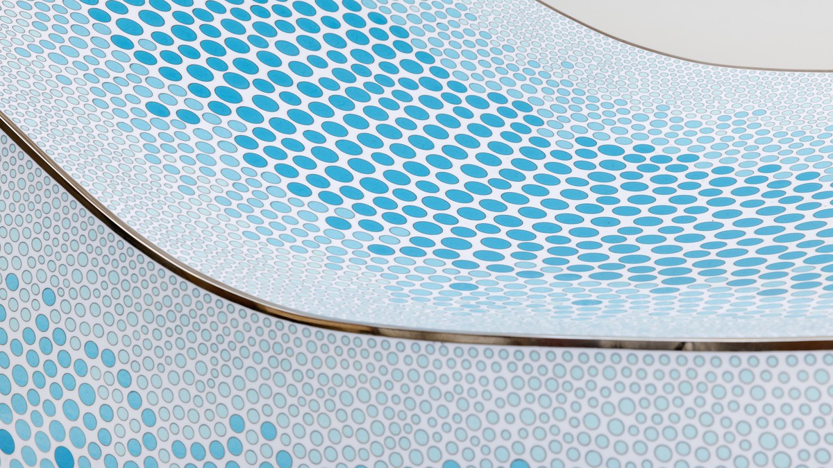 Detail of blue and white cloisonné work on a chair by Marc Newson