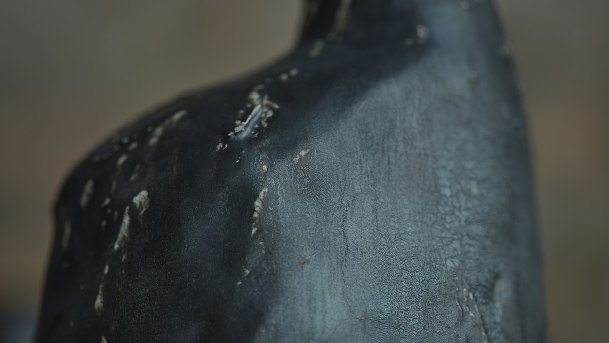 Detail of a stoneware vessel with black glaze