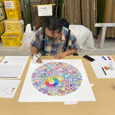 Takashi Murakami signing his print Thank You for the Wonderful Destiny (2020) in his studio, Saitama, Japan. Artwork © 2020 Takashi Murakami/Kaikai Kiki Co., Ltd. All rights reserved