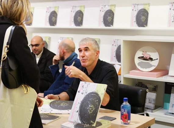 Adam McEwen signing copies of his book Sidewalks at the Gagosian Shop, New York, 2022