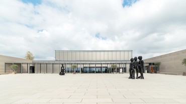 Georg Baselitz’s Yellow Song (2013; left) and BDM Gruppe (2012; right) installed outside Museum Würth 2, Künzelsau, Germany. Artwork © Georg Baselitz 2023