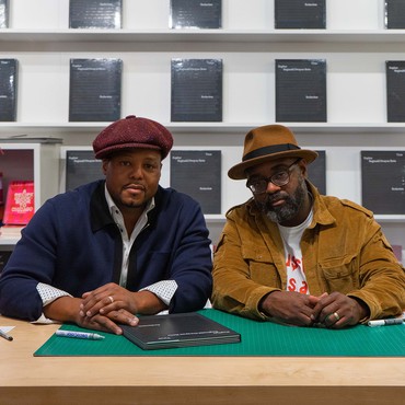 Titus Kaphar and Reginald Dwayne Betts signing copies of their book Redaction at the Gagosian Shop, New York, 2023. Photo: Mauricio Zelaya