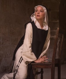 Image of kneeling nun, still from Paul Verhoeven’s Benedetta (2021)