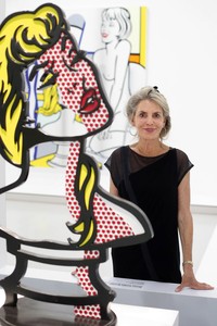 Portrait of Dorothy Lichtenstein standing behind a Roy Lichtenstein sculpture