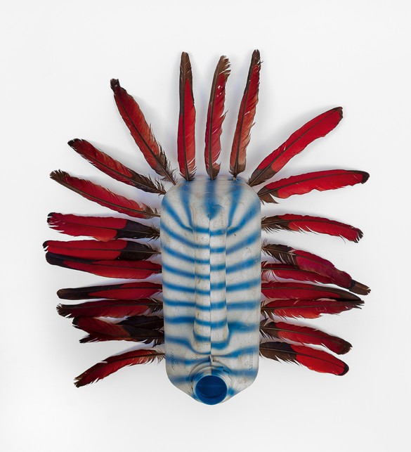 Romuald Hazoumè, Oiseau bleu, 2018, plastic and feathers, 15 × 15 × 6 ⅜ inches (38 × 38 × 16 cm)