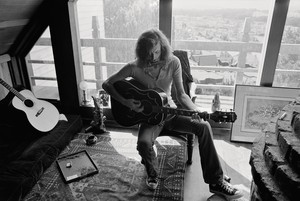 <p>Graham Nash at home, San Francisco, 1972. An M. C. Escher print from his collection can be seen on the floor to the right. Photo: Joel Bernstein</p>