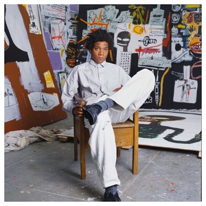 <p>Jean-Michel Basquiat in his studio at 21 Market Street, Venice, California, spring 1984. Photo: Brad Branson</p>