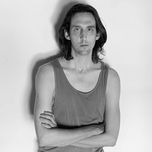 Black-and-white portrait of Travis Diehl