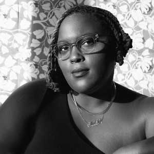 Black-and-white portrait of Amber J. Phillips