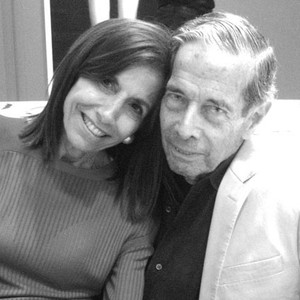 Black-and-white portrait of Dodie Kazanjian and another person