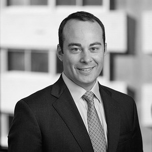 Black-and-white portrait of Luke Nikas