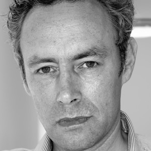 Black-and-white portrait of Mark Hudson