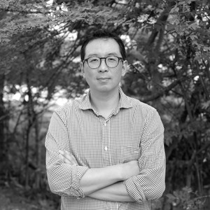 Black-and-white portrait of Joshua Chuang