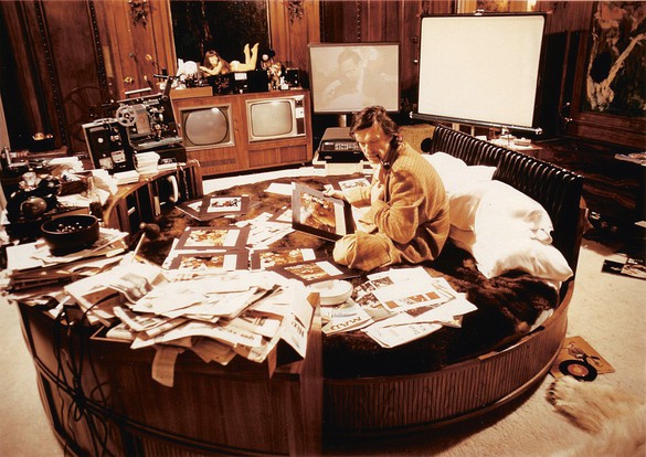 Hugh Hefner working from his bed at the Playboy Mansion