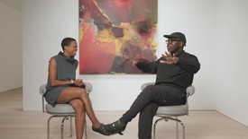 Amanda Williams and Derrick Adams sit in front of "CandyLadyBlack (Even When You Talk It Takes Over Me), 2022
