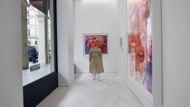 Image of Jenny Saville standing in front of her artworks