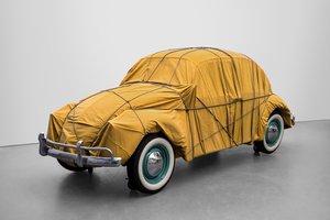 1961 Volkswagen Beetle Saloon wrapped in mustard yellow tarpaulin and rope