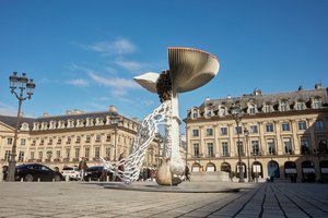 Large-scale sculpture of a mushroom installed in a plaza in Paris
