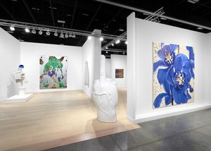 Installation view of artworks hanging in a booth