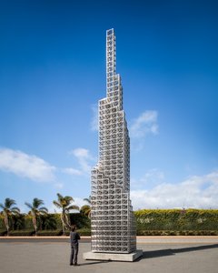 Erector steel Skyscraper reproduction with a person looking up at it