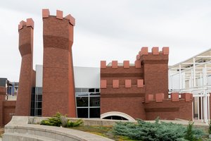 Brick sculpture castle on the facade of a building