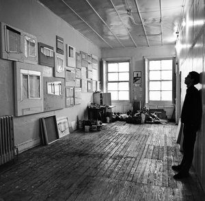 Christo standing in his studio in New York