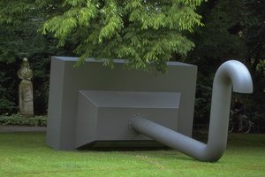 Large metal sculpture resembling a pipe
