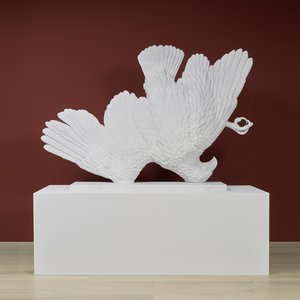 Large marble sculpture of an upside-down eagle