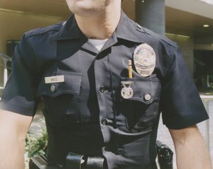 Photograph of the chest of a police officer in uniform